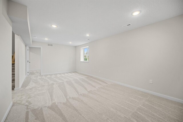 4408 Honey Bee Rdg, Des Moines, IA 50317 - basement featuring light carpet, recessed lighting, and stairway