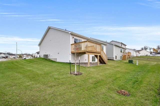 4408 Honey Bee Rdg, Des Moines, IA 50317 - back of house featuring stairway, a wooden deck, and a yard