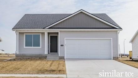4408 Honey Bee Rdg, Des Moines, IA 50317 - view of front of house with an attached garage and driveway