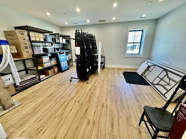 105 S 4th St, Clear Lake, IA 50428 - workout room featuring wood finished floors, baseboards, and recessed lighting