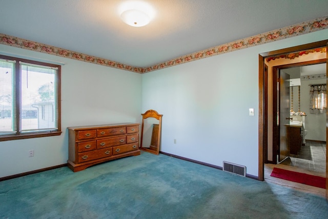 empty room with carpet floors and baseboards