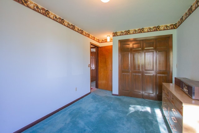 unfurnished bedroom with carpet floors and a closet