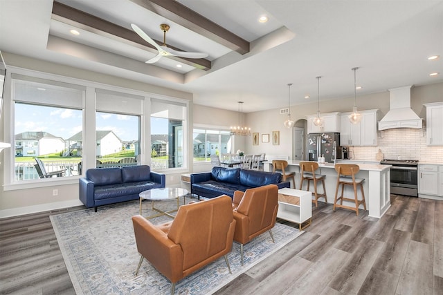 3316 NW 27th St, Ankeny, IA 50023 - living area with ceiling fan, wood finished floors, recessed lighting, a chandelier, and beam ceiling