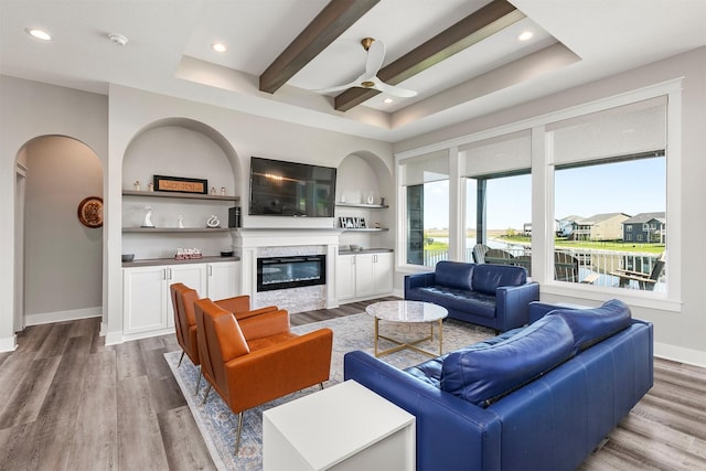 3316 NW 27th St, Ankeny, IA 50023 - living room with a glass covered fireplace, light wood finished floors, a ceiling fan, recessed lighting, and baseboards