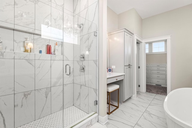 3316 NW 27th St, Ankeny, IA 50023 - full bath featuring marble finish floors, a shower stall, a freestanding tub, and a spacious closet