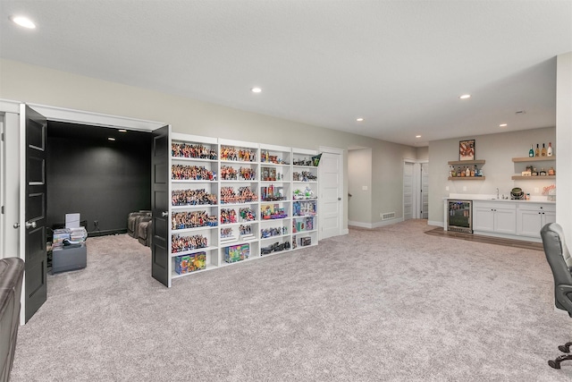 3316 NW 27th St, Ankeny, IA 50023 - office featuring bar with sink, beverage cooler, carpet flooring, recessed lighting, and baseboards