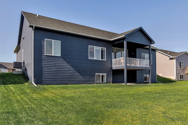 3316 NW 27th St, Ankeny, IA 50023 - back of house with cooling unit, a yard, and a balcony