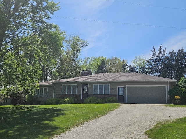 1991 190th Ave, Osceola, IA 50213 - single story home with driveway, a front lawn, a garage, a chimney, and brick siding