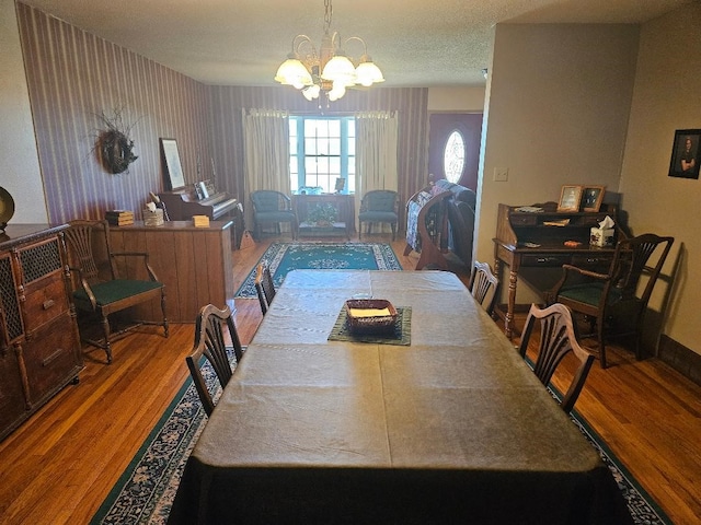 1991 190th Ave, Osceola, IA 50213 - dining space with wood finished floors and a chandelier