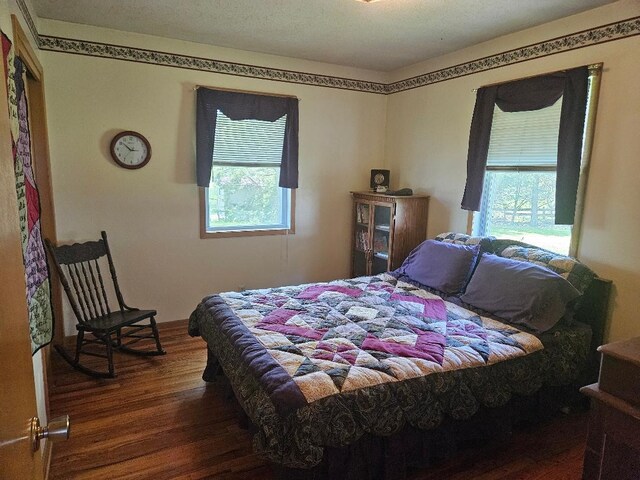 1991 190th Ave, Osceola, IA 50213 - bedroom with wood finished floors and multiple windows