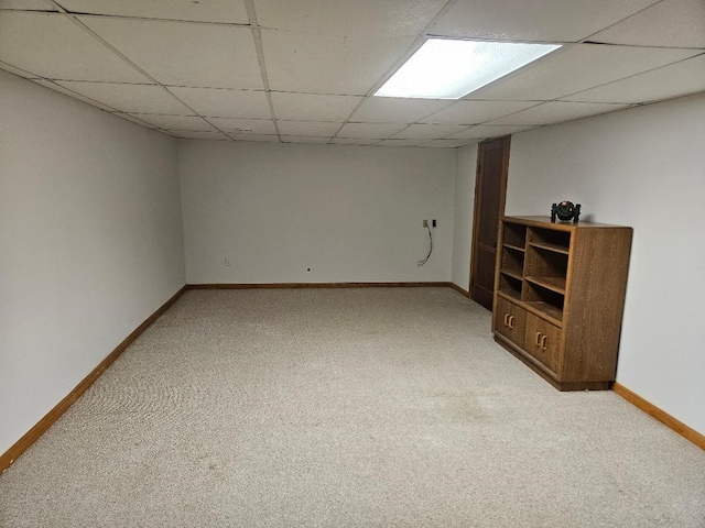 1991 190th Ave, Osceola, IA 50213 - finished basement featuring light colored carpet, baseboards, and a paneled ceiling