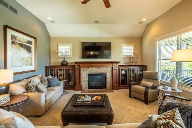 9257 Sugar Creek Dr, West Des Moines, IA 50266 - living room featuring lofted ceiling, ceiling fan, light carpet, a premium fireplace, and recessed lighting