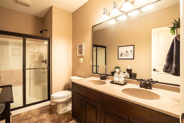 9257 Sugar Creek Dr, West Des Moines, IA 50266 - bathroom featuring a stall shower, toilet, and double vanity