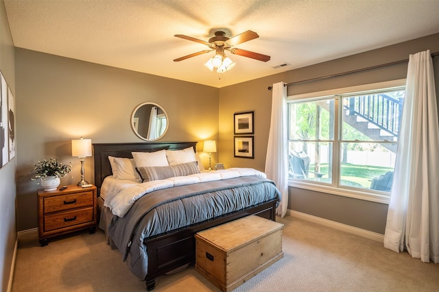 9257 Sugar Creek Dr, West Des Moines, IA 50266 - bedroom featuring light carpet, baseboards, and a ceiling fan