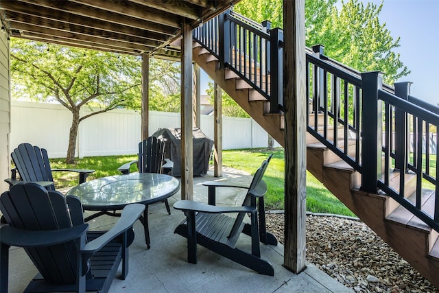 9257 Sugar Creek Dr, West Des Moines, IA 50266 - view of patio / terrace with stairs, a grill, and outdoor dining space