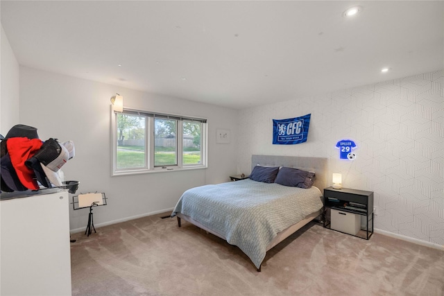 bedroom with baseboards, light colored carpet, and recessed lighting