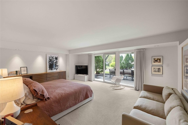 bedroom featuring access to outside and carpet floors