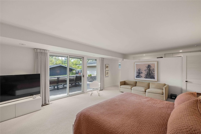 carpeted bedroom featuring access to outside and recessed lighting
