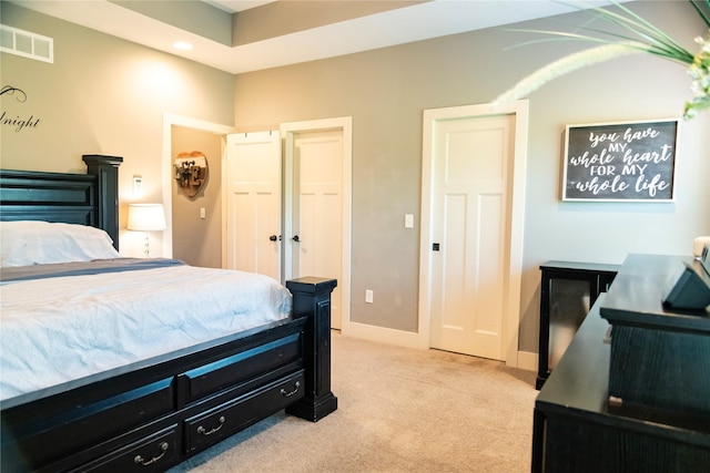 bedroom featuring light colored carpet, baseboards, and recessed lighting
