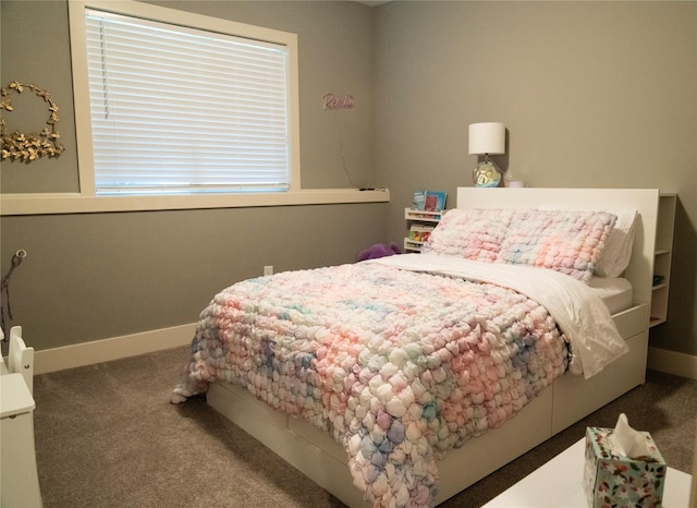 carpeted bedroom with baseboards