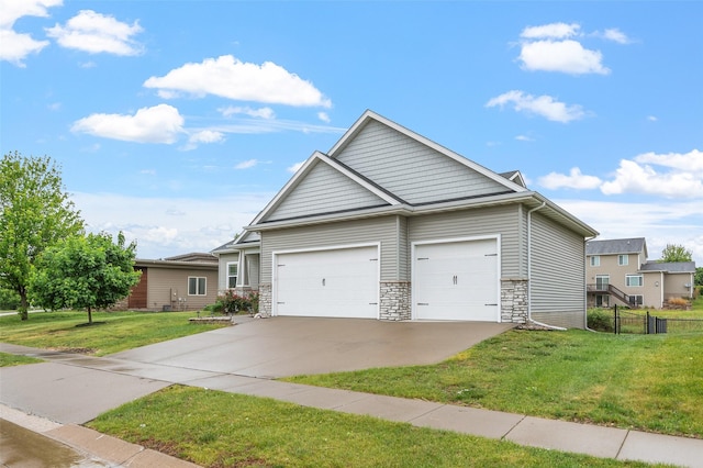 235 Emerson Ln, Waukee, IA 50263 - view of front of house with stone siding, a garage, and concrete driveway