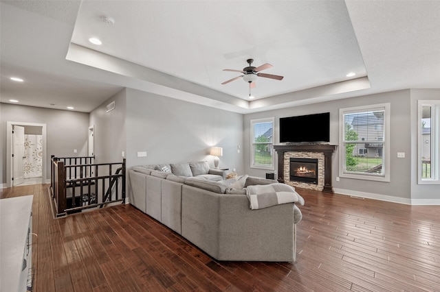 235 Emerson Ln, Waukee, IA 50263 - living area with a raised ceiling, ceiling fan, dark wood-style floors, baseboards, and recessed lighting