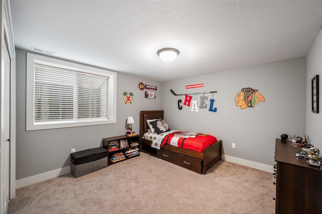 235 Emerson Ln, Waukee, IA 50263 - carpeted bedroom featuring a textured ceiling and baseboards