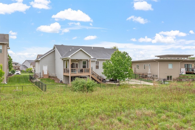 235 Emerson Ln, Waukee, IA 50263 - rear view of property with a wooden deck, a fenced backyard, and stairway