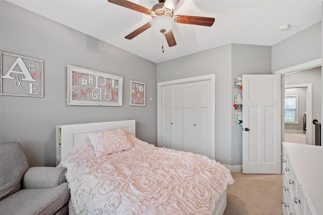 235 Emerson Ln, Waukee, IA 50263 - bedroom with light colored carpet, a closet, a ceiling fan, and baseboards
