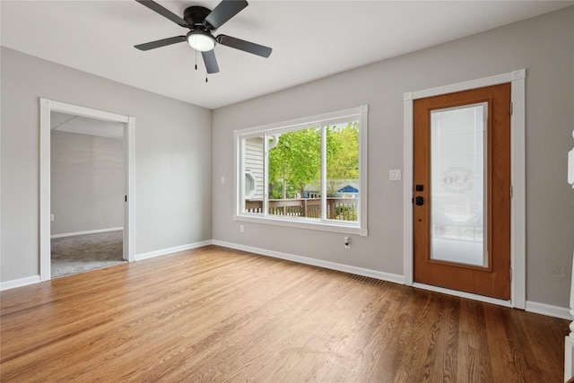 330 E 13th St N, Newton, IA 50208 - foyer with baseboards, a ceiling fan, and wood finished floors