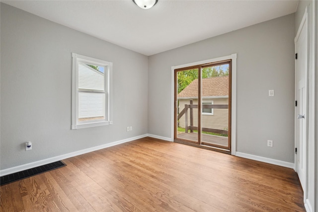 330 E 13th St N, Newton, IA 50208 - empty room with wood finished floors and baseboards