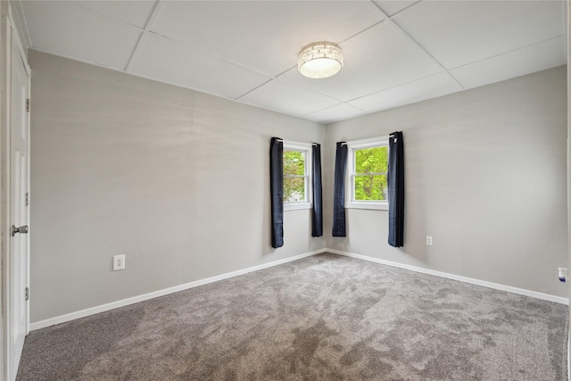 330 E 13th St N, Newton, IA 50208 - spare room with baseboards, carpet, and a drop ceiling