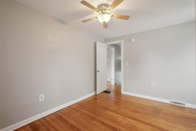 330 E 13th St N, Newton, IA 50208 - spare room featuring baseboards, ceiling fan, light wood-style flooring, and a smoke detector