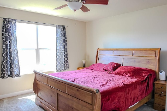4917 Richmond Ave, Des Moines, IA 50317 - bedroom with carpet flooring, baseboards, and ceiling fan