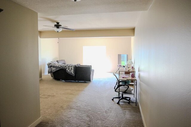 4917 Richmond Ave, Des Moines, IA 50317 - carpeted bedroom with an office area, baseboards, and a ceiling fan