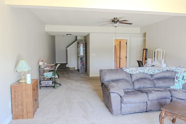 4917 Richmond Ave, Des Moines, IA 50317 - living area featuring a ceiling fan, light colored carpet, and baseboards