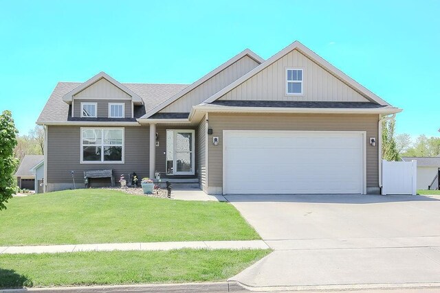 4917 Richmond Ave, Des Moines, IA 50317 - craftsman house with an attached garage and concrete driveway