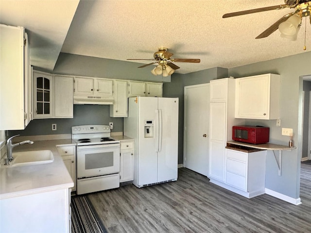 kitchen with white appliances, under cabinet range hood, a sink, a ceiling fan, and a textured ceiling