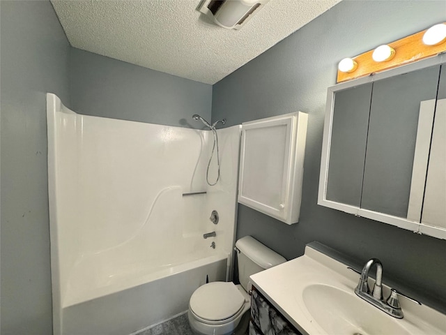 full bathroom featuring a textured ceiling, toilet, bathing tub / shower combination, and vanity