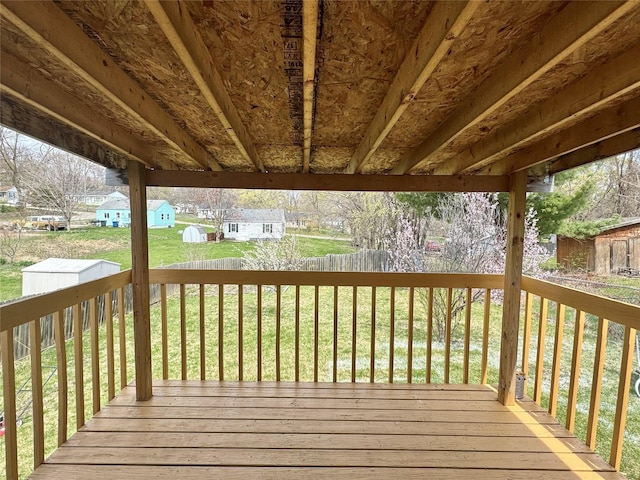 wooden terrace with an outdoor structure