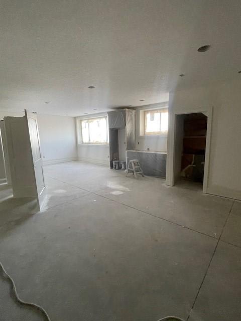 8236 Mahon Ct, Johnston, IA 50131 - basement featuring healthy amount of natural light