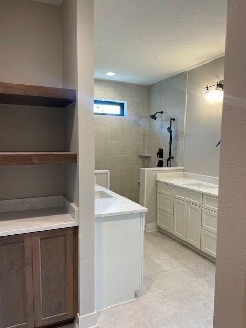 8236 Mahon Ct, Johnston, IA 50131 - bathroom featuring two vanities and a walk in shower