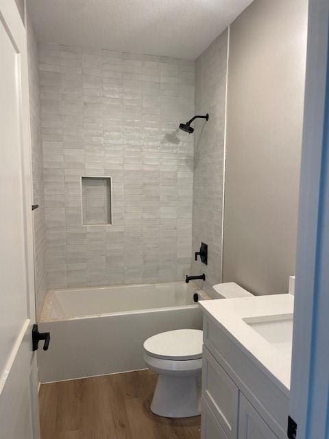 8236 Mahon Ct, Johnston, IA 50131 - full bathroom with vanity, wood finished floors, and shower / bath combination