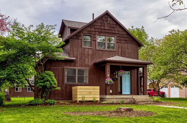 rustic home with a front lawn and roof with shingles