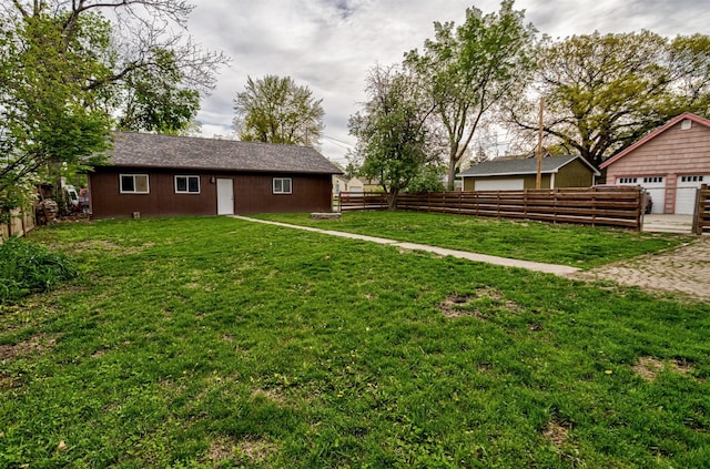 view of yard with a detached garage