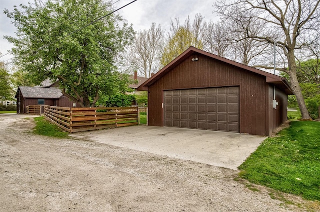 detached garage with fence