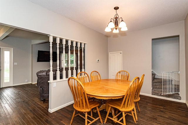 dining room featuring a chandelier, hardwood / wood-style floors, stairway, and baseboards