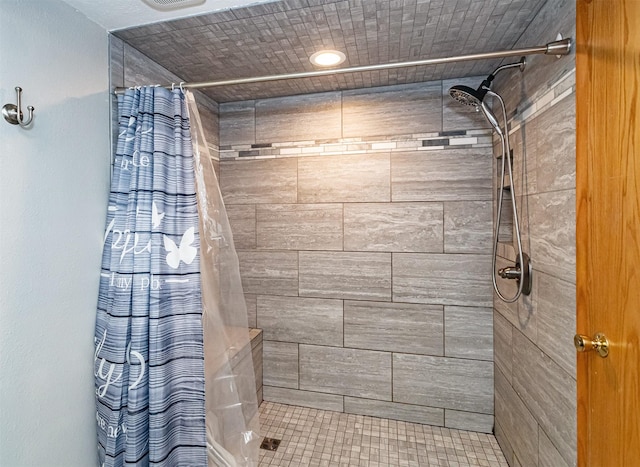 full bath featuring tiled shower