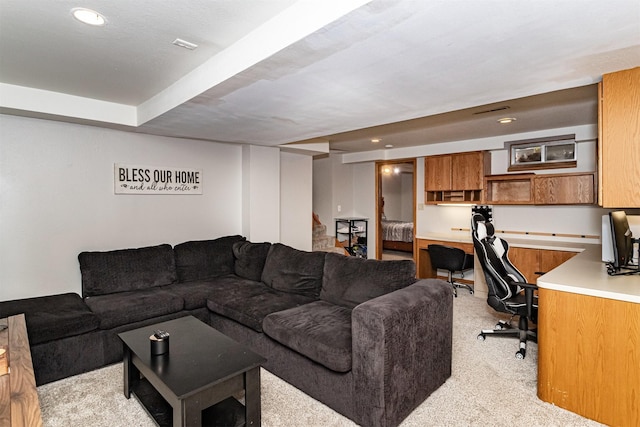 living room with light carpet and recessed lighting