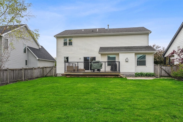 back of property with a wooden deck